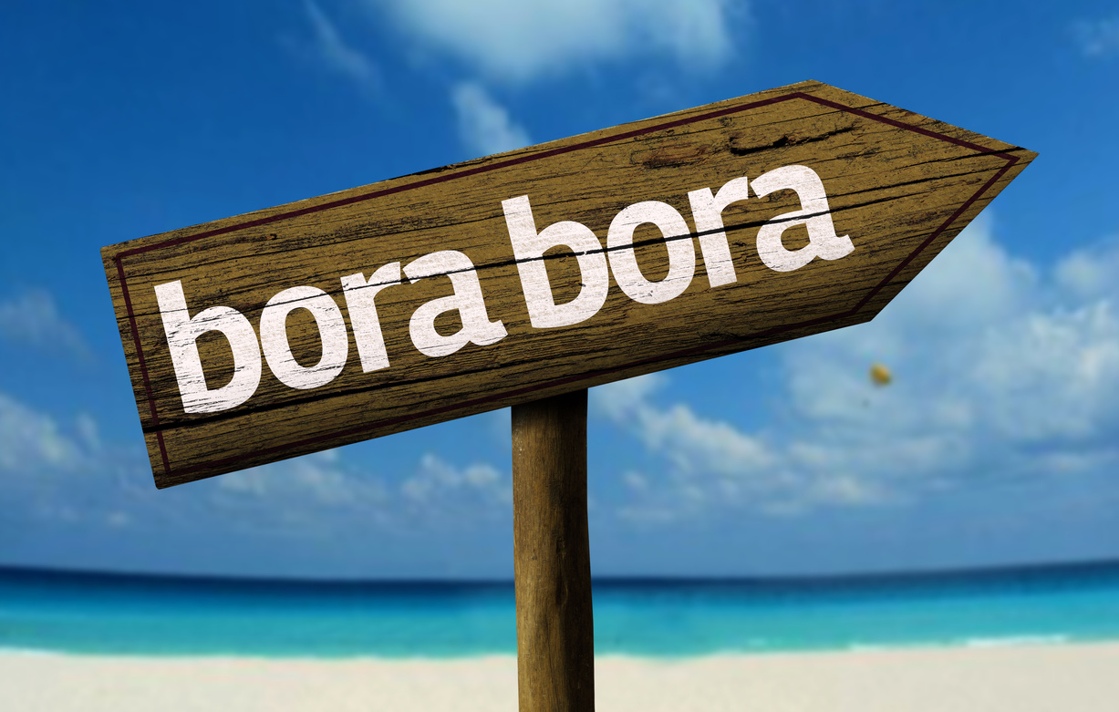 Bora Bora wooden sign on the beach